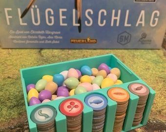 Wing flap organizer for tokens and eggs