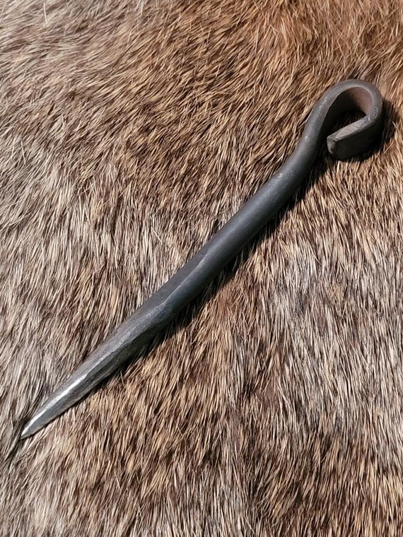 A hand-forged titanium marlin spike is a niche blacksmith flex — ultralight, functional, and made from a metal most smiths avoid entirely.