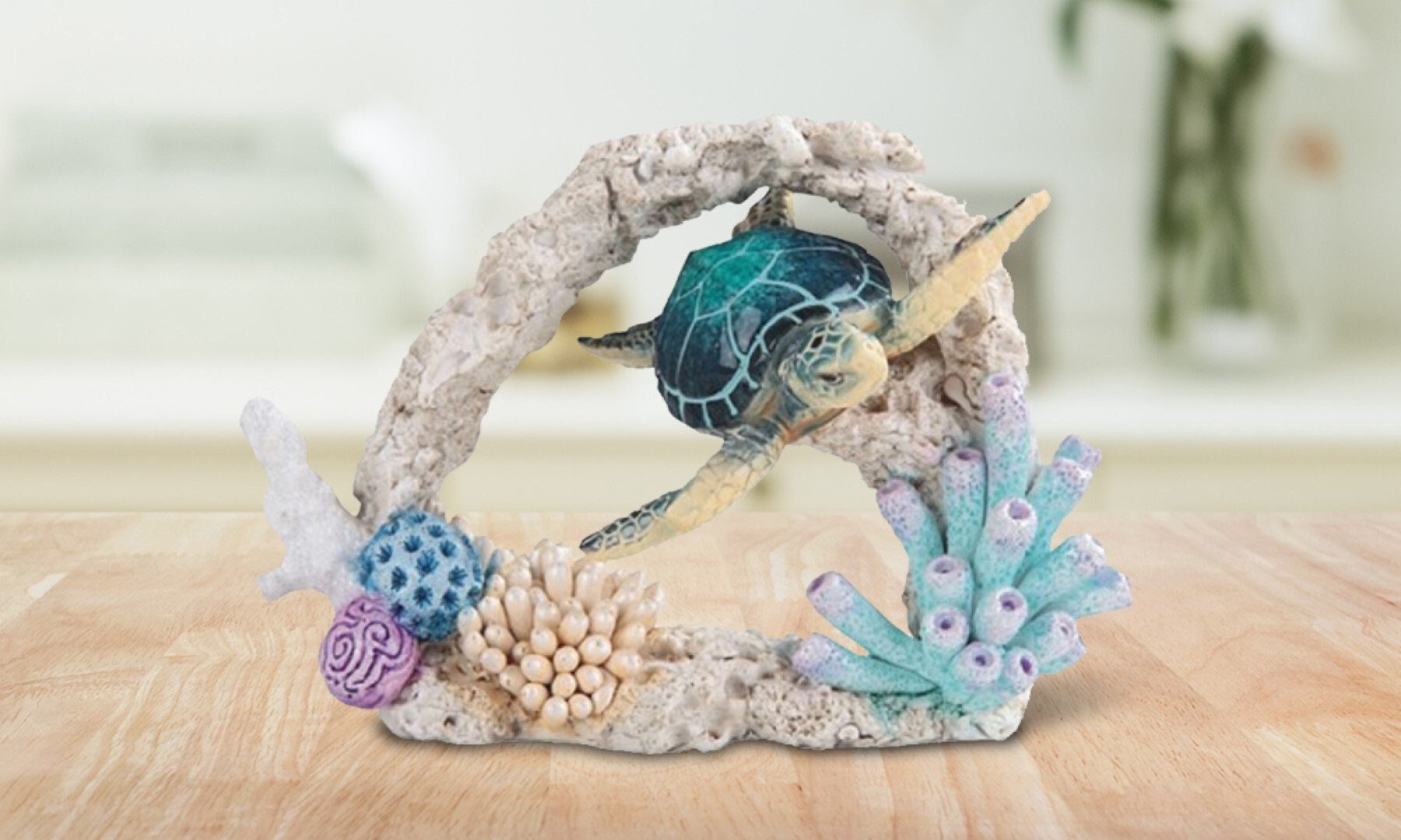 Blue sea turtle swimming around coral statue marine life