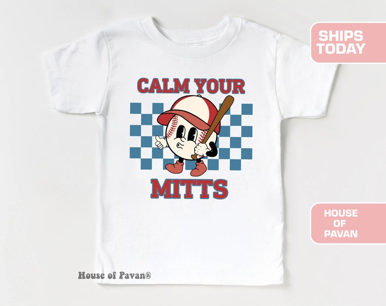 May include: White t-shirt with a red, white, and blue baseball graphic and the text "Calm Your Mitts".