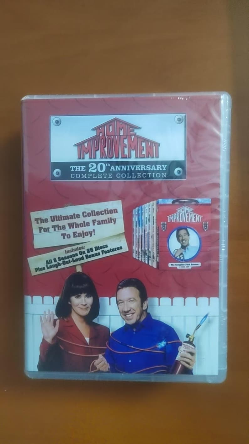May include: DVD set of the television show "Home Improvement: The 20th Anniversary Complete Collection." The cover features the show's logo, cast photos, and text that reads "The Ultimate Collection For The Whole Family To Enjoy!" and "All 8 Seasons On 25 Discs Plus Laugh-Out-Loud Bonus Features."