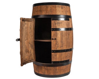 May include: A wooden barrel-shaped cabinet with a door that opens to reveal two shelves. The cabinet is made of brown wood with black metal accents.