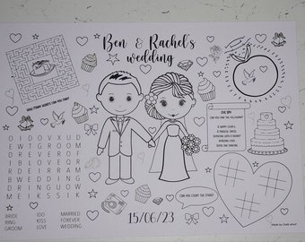 May include: A black and white printable wedding activity sheet with a maze, word search, connect the dots, and a tic-tac-toe game. The sheet features a cartoon bride and groom, a wedding cake, and the text "Ben & Rachel's wedding" and "15/06/23".