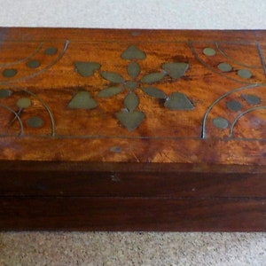 Wooden trinket box with floral brass inlay