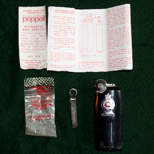 Vintage H.M.Y. Britannia souvenir lighter by Poppell