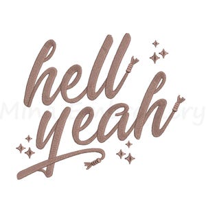 May include: A brown embroidered design on a white background. The design features the words "hell yeah" in a cursive font, with decorative tassels and star accents. The overall style is casual and decorative.