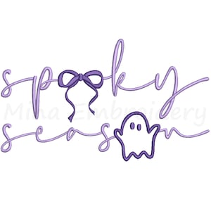 May include: A light purple design with the words "spooky season" in a cursive font. A bow and a ghost are incorporated into the design. The design is suitable for Halloween-themed products.