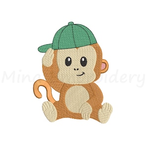 May include: A brown monkey wearing a green baseball cap sits with its legs crossed and its tail curled around its body. The monkey has a pink nose and a happy expression.