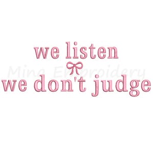 May include: Pink embroidered design with the text "we listen we don't judge" and a small pink bow.