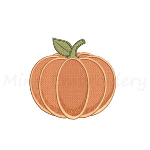 May include: An orange pumpkin embroidery design featuring a rounded shape with distinct vertical segments, a light green stem, and a single green leaf. The pumpkin is rendered with a textured stitch pattern and a defined outline throughout.
