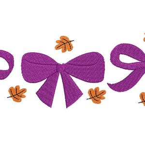 May include: An embroidered design featuring three purple bows and scattered orange leaves. The bows are detailed with stitched textures, and the leaves have a simple, stylized appearance. The design is set against a clean white background.