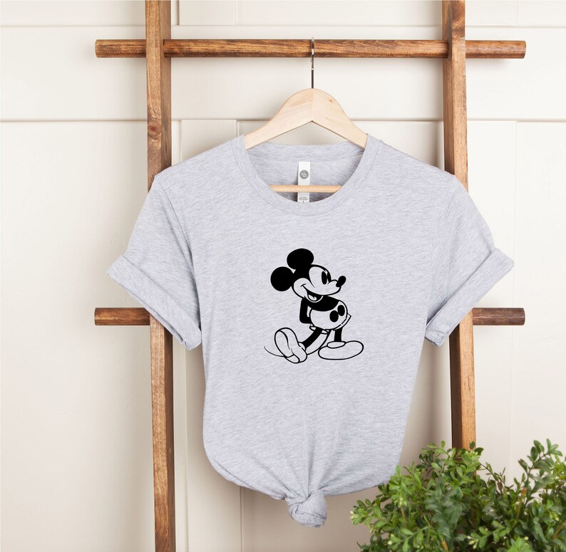 May include: A gray t-shirt with a black and white image of Mickey Mouse on the front.