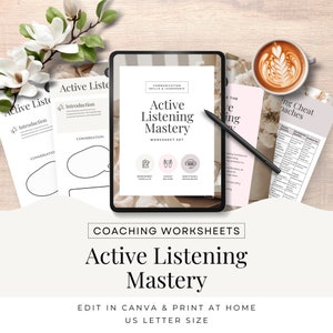 May include: A digital tablet displaying a worksheet set for active listening mastery. The worksheet set includes a worksheet template, coach helper, and additional resources. The text "Active Listening Mastery" is displayed in a bold, black font on a white background. The tablet is on a wooden surface with a cup of coffee and a flower.