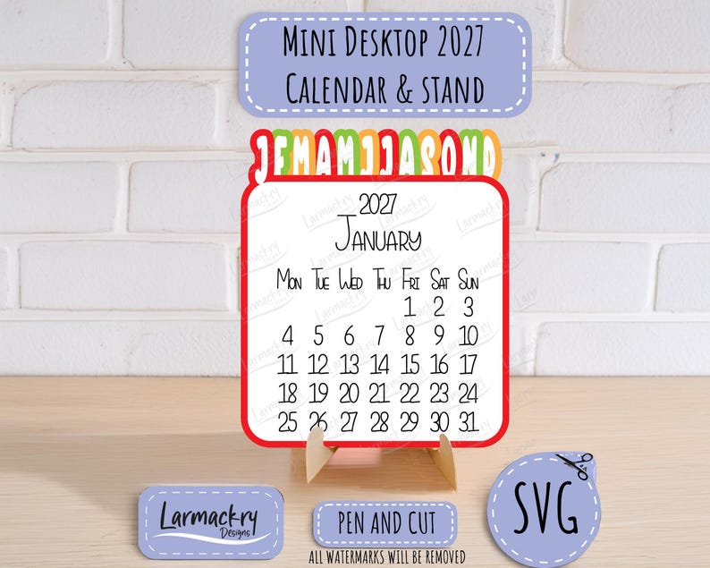 May include: A 2027 mini desktop calendar and stand featuring a white square card with black text for January, a red border, and a colorful monthly tab header. Includes small labels reading Mini Desktop 2027 Calendar & Stand, Pen and Cut, and SVG.