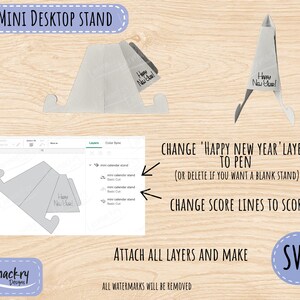 May include: A white mini desktop stand digital file for cutting machines. The design includes a foldable structure with a Happy New Year inscription. The image displays the SVG file interface with layer instructions for pen, score, and cut settings.