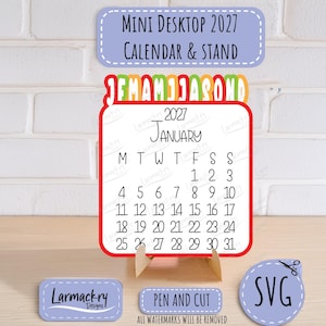 May include: A 2027 mini desktop calendar and stand featuring a white card with black text for January, a red border, and a colorful monthly tab header. Includes small labels with the text Mini Desktop 2027 Calendar & Stand, Larmackry Designs, and SVG.