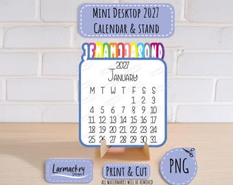May include: A 2027 mini desktop calendar and stand featuring a white page with black text for January, a colorful monthly tab header, and light purple labels with the text Mini Desktop 2027 Calendar & Stand, Print & Cut, and PNG.