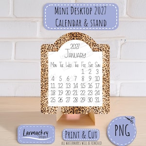 May include: A mini desktop 2027 calendar and stand featuring a leopard print border. The calendar displays the month of January with black text on a white background. Included are small labels reading Mini Desktop 2027 Calendar & Stand, Larmackry Designs, Print & Cut, and PNG.