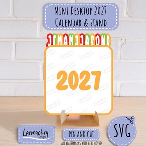 May include: A 2027 mini desktop calendar and stand featuring a square card with the year 2027 in large orange font. Above the card are colorful month initials. Includes labels reading Mini Desktop 2027 Calendar & Stand, Larmackry Designs, Pen and Cut, and SVG.