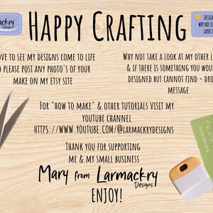 May include: A light wood grain background featuring black text that reads Happy Crafting, Larmackry Designs, and instructions for social media and tutorials. Black scissors are on the left, and a green cutting mat with a scraper tool are on the right.