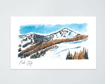 May include: Watercolor print of a snow-covered mountain range with a blue sky. The artwork features brown trees and the text "Park City" in a handwritten font. The overall theme is a winter landscape.