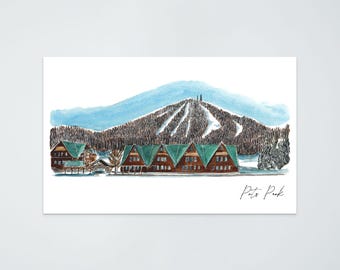 May include: Watercolor print of Pete's Peak, featuring a mountain with ski slopes and a series of brown cabins with green roofs. The sky is light blue, and the artwork has a hand-painted aesthetic.