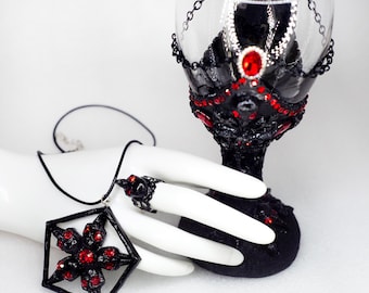 May include: A black goblet decorated with red rhinestones and a black chain, accompanied by a matching black pendant necklace and a ring featuring a star-shaped design with red rhinestones. The text WWW.WGMWORKSHOP.ETSY.COM is visible.