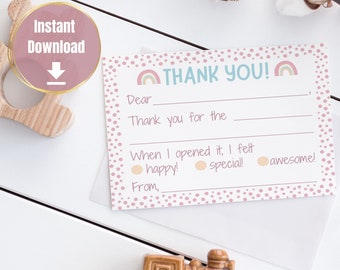 May include: Pink thank you card with rainbow design and polka dots. The card has fill-in-the-blank lines for writing a message. The text on the card reads "Thank You!" and "When I opened it, I felt happy! special! awesome!"