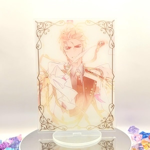 May include: A clear acrylic stand featuring an anime-style illustration of a character with blonde hair and a detailed outfit. The stand is on a white rotating platform surrounded by colorful, faceted gems.