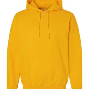Puede incluir: Una sudadera con capucha de color amarillo mostaza con capucha con cord&oacute;n y bolsillo de canguro. La sudadera est&aacute; hecha de un material suave y es adecuada para ropa casual. La sudadera con capucha es de color amarillo brillante.