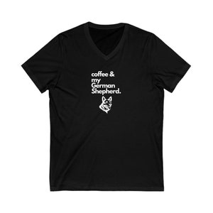 May include: Black V-neck t-shirt with white text that reads "coffee & my German Shepherd." A white silhouette of a German Shepherd's head is below the text.