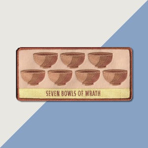 May include: A beige embroidered patch with seven brown bowls and the text "SEVEN BOWLS OF WRATH".