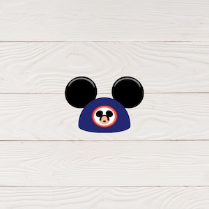 May include: A blue and red Mickey Mouse head silhouette with black ears. The silhouette is on a white wood background.