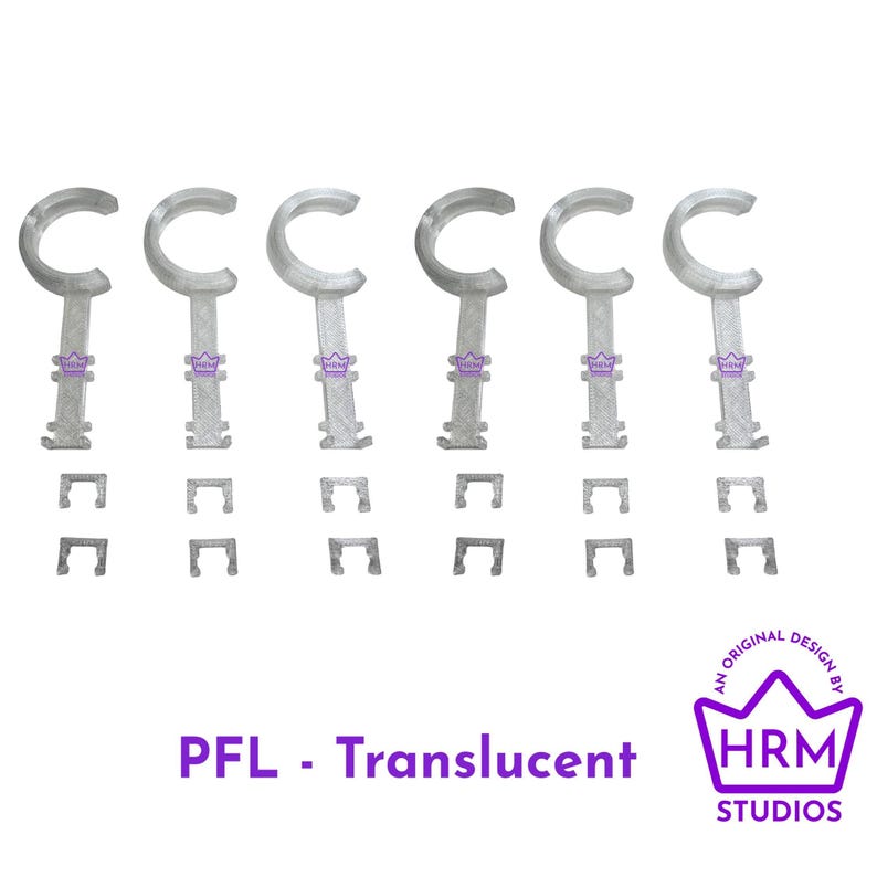 Puede incluir: Un conjunto de componentes de pl&aacute;stico transl&uacute;cido en forma de C con piezas rectangulares a juego. El texto "PFL - Translucent" se muestra debajo de los objetos, con un logotipo p&uacute;rpura que dice "HRM STUDIOS" y "AN ORIGINAL DESIGN BY".