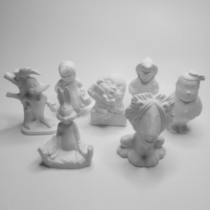 May include: Set of six white ceramic figurines, including a rabbit, a lion, a girl in a dress, a boy with a phone, a cartoon bird, and a snowman. The figurines are unpainted and ready to be decorated.