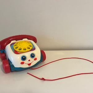 Vintage Fisher Price Rotary Telephone Pull Toy with Rotating Eyes