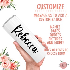 May include: White stainless steel tumbler with the name "Rebecca" in black cursive lettering. The tumbler is being held by a hand. The image also includes text that says "Customize" and "Message us to add a customization".