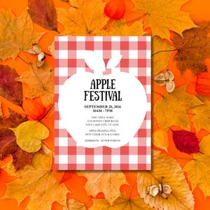 Puede incluir: Un anuncio del Festival de la Manzana sobre un fondo a cuadros rojos y blancos, rodeado de hojas de otoño. El texto dice "APPLE FESTIVAL" con la fecha, hora y detalles del lugar. Incluye "Apple Picking, Pies, Hot Cider, Fun & Games".