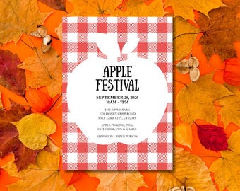Op de afbeelding: Een Apple Festival-aankondiging op een wit en rood geruite achtergrond, omringd door herfstbladeren. De tekst luidt "APPLE FESTIVAL" met de datum, tijd en locatiegegevens. Bevat "Apple Picking, Pies, Hot Cider, Fun & Games".