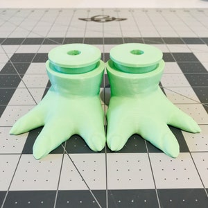 Feet with ankles and pegs, used in custom installations, shown in regular baby Yoda Green.  Specifically designed to fit leg pants by the Little Green Jelly Bean Bodies BY CSF shop here on Etsy: https://www.etsy.com/shop/LilGreenBeansbyCSF