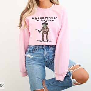 Hold On Partner I'm Pregnant Sweatshirt Funny Pregnancy Reveal Shirt Cowboy Frog Pregnancy Announcement Meme Maternity Gift Expecting Baby Light Pink