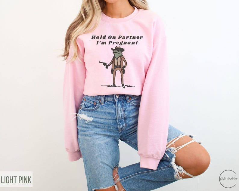 Hold On Partner I'm Pregnant Sweatshirt Funny Pregnancy Reveal Shirt Cowboy Frog Pregnancy Announcement Meme Maternity Gift Expecting Baby Light Pink