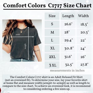 May include: Size chart for Comfort Colors C1717 shirts. Measurements in inches are provided for sizes S through 3XL. The chart includes length and width dimensions for each size. The image also shows a person wearing the shirt.