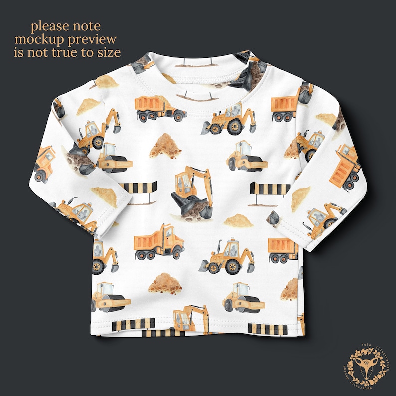 May include: White long-sleeved shirt with a repeating pattern of yellow construction vehicles, including excavators, dump trucks, and road rollers. The vehicles are painted in a watercolor style on a white background.