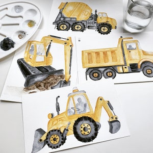 May include: A set of four watercolor paintings of yellow construction vehicles. The vehicles include a cement mixer, a dump truck, an excavator, and a backhoe. The paintings are on white paper with a light brown background.