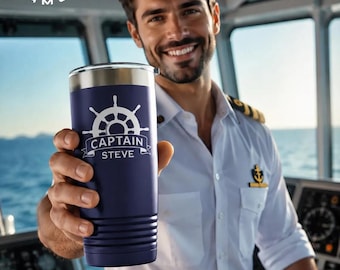 May include: A dark blue stainless steel tumbler featuring a white ship wheel graphic and the text CAPTAIN STEVE. The cylindrical container has horizontal ridges near the base and a silver rim. A white logo with a camel and mountains reads POLAR CAMEL.