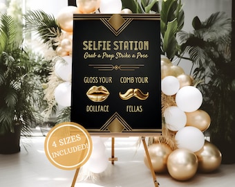 May include: A black and gold sign with the text "Selfie Station" and "Grab a Prop Strike a Pose". The sign also has the text "Gloss Your Dollface" and "Comb Your Fellas" with a gold lip and mustache graphic. The sign is on a wooden easel and surrounded by gold and white balloons.