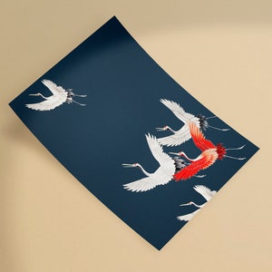 May include: A navy blue print featuring white and red cranes in flight. The birds are depicted with detailed wings and long legs, set against a dark background. The artwork has an Asian-inspired aesthetic.