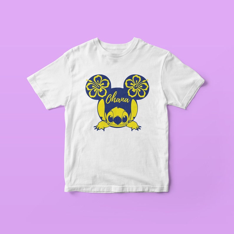 May include: White t-shirt with a blue Stitch character wearing yellow hibiscus flowers on its ears. The text "Ohana" is written on the character's head.