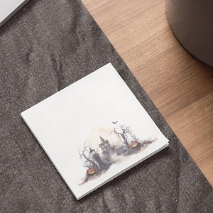 May include: A watercolour illustration of a spooky Halloween scene with a haunted house, trees, and pumpkins. The illustration is in shades of grey and brown, with a touch of orange for the pumpkins.